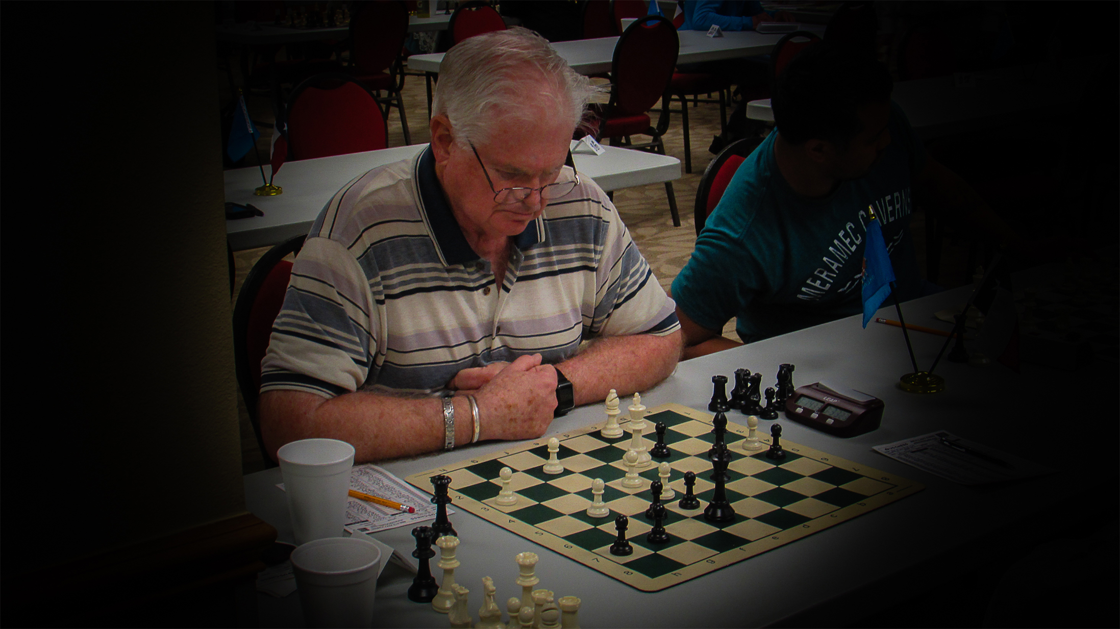 Larry Deputy is a US Chess Life Member and has an 1838 FIDE rating.  He is ranked in the 86th Percentile for all USA chess players and in the 56th Percentile for all USA seniors.  He is ranked Number 56 in Oklahoma.  In RRSO XVII, his second RRSO, he split his match against a very tough Texan.  Photo by Mike Tubbs.
